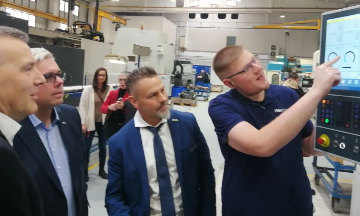 Stefan Kittendorf (GEA Machine Operator) explains and demonstrates new CNC machining equipment to Thomas Strotkoetter (Heating & Refrigeration Technologies, GEA), Tobias Lunge (Managing Director GEA AWP) and Hendrik Sommer (Mayor of Prenzlau). Photo Credit: GEA