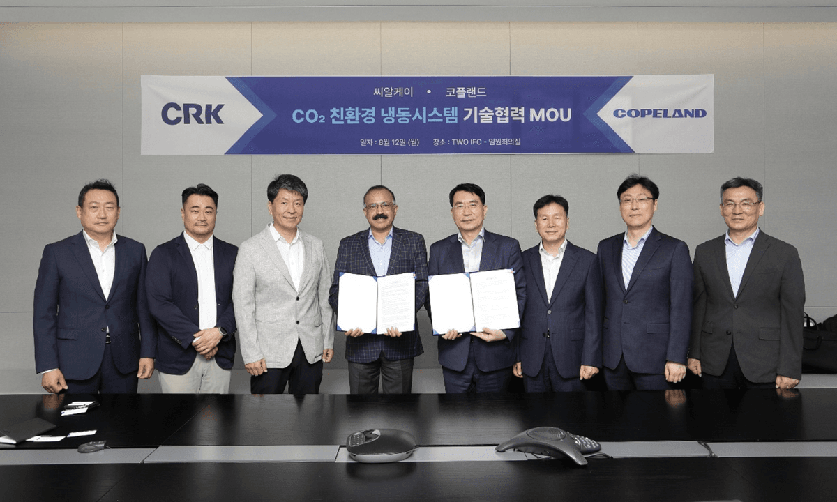 Copeland is forming a partnership for a cold chain technology project in South Korea. Pictured here are members of Copeland signing an MOU with CRK, the South Korean contractor leading the project.