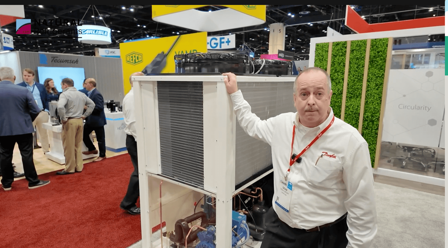 Dean Groff, Field Services Manager at Danfoss, in front of the Danfoss CO2 condensing unit at AHR 2025
